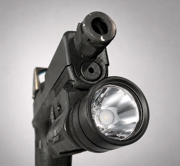 Flashlight lens with LG-01 ceramic coating — clean coated optic